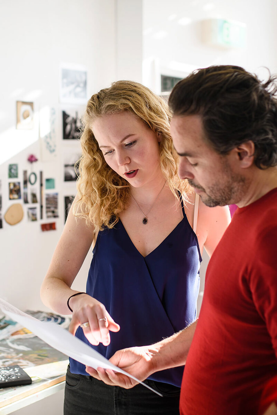 Lecturer and student in Fine Art studio Student and lecturer look at artwork in fine art studio